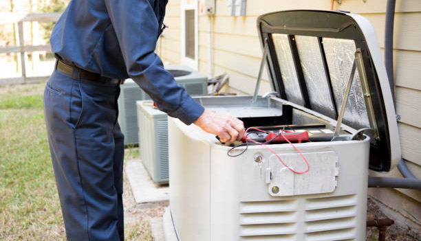 Senior Adult air conditioner Technician/Electrician  services outdoor AC unit and the Gas Generator.  He is doing a complete service check up on both of the outside  air conditioning units and the stand by generator.